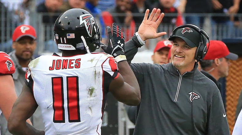 102515 NASHVILLE: -- Falcons wide receiver Julio Jones gets a high five from head coach Dan Quinn after scoring the game winning touchdown for a 10-7 victory over the Titans in a football game on Sunday, Oct. 25, 2015, in Nashville. Curtis Compton / ccompton@ajc.com