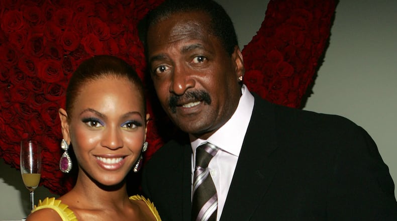 Singer Beyonce Knowles poses with her father and manager Matthew Knowles at the 'Beyonce: Beyond the Red Carpet auction presented by Beyonce and her mother Tina Knowles along with the House of Dereon to benefit the VH1 Save The Music Foundation June 23, 2005 in New York City.  (Photo by Frank Micelotta/Getty Images)