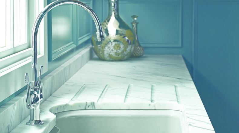 Single-hole two-handle kitchen faucets look like a larger version of a bar sink faucet. (Kohler)