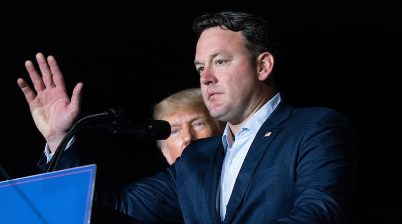 Georgia lieutenant gubernatorial candidate State Sen. Burt Jones (R-Georgia) speaks at a rally as former U.S. President Donald Trump watches on Sept. 25, 2021 in Perry, Georgia. (Sean Rayford/Getty Images/TNS)