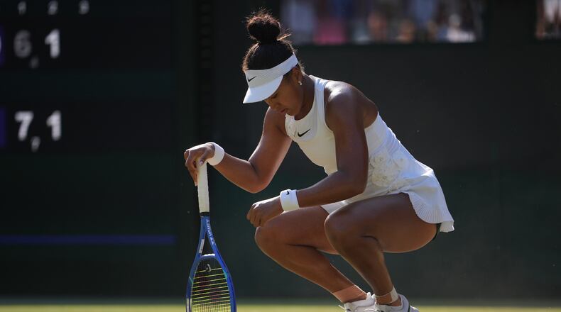 Naomi Osaka of Japan reacts to losing a point against Karolina Muchova of Czech Republic in their quarter-final women's singles match at the Wimbledon Tennis Championships in London, Tuesday, July 7, 2026. (AP Photo/Kin Cheung)