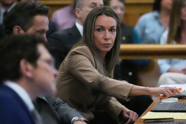 Karen Read sits with her defense team during her trial, Thursday, April 24, 2025, at Norfolk Superior Court in Dedham, Mass. (AP Photo/Charles Krupa, Pool)