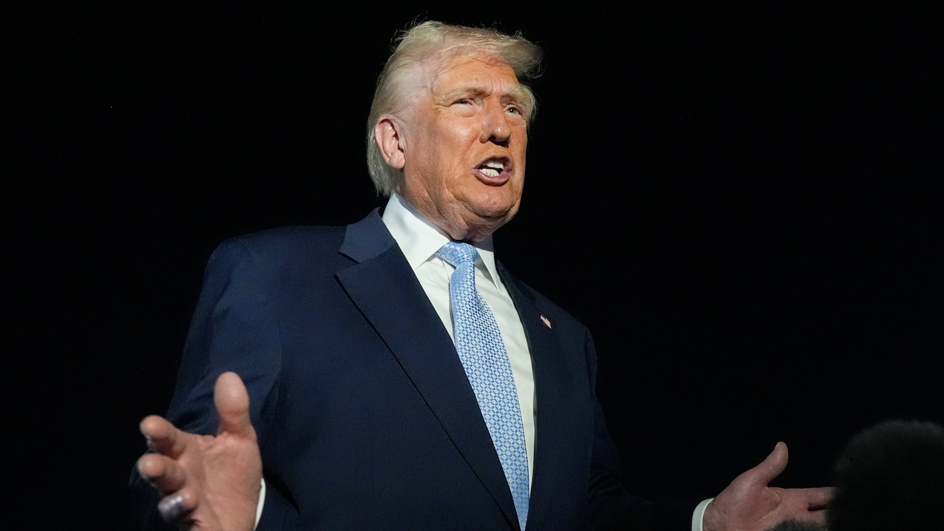 President Donald Trump speaks to reporters before boarding Air Force One at Palm Beach International Airport in West Palm Beach Fla., on his way back to the White House, Sunday, Nov. 16, 2025. (AP Photo/Manuel Balce Ceneta)