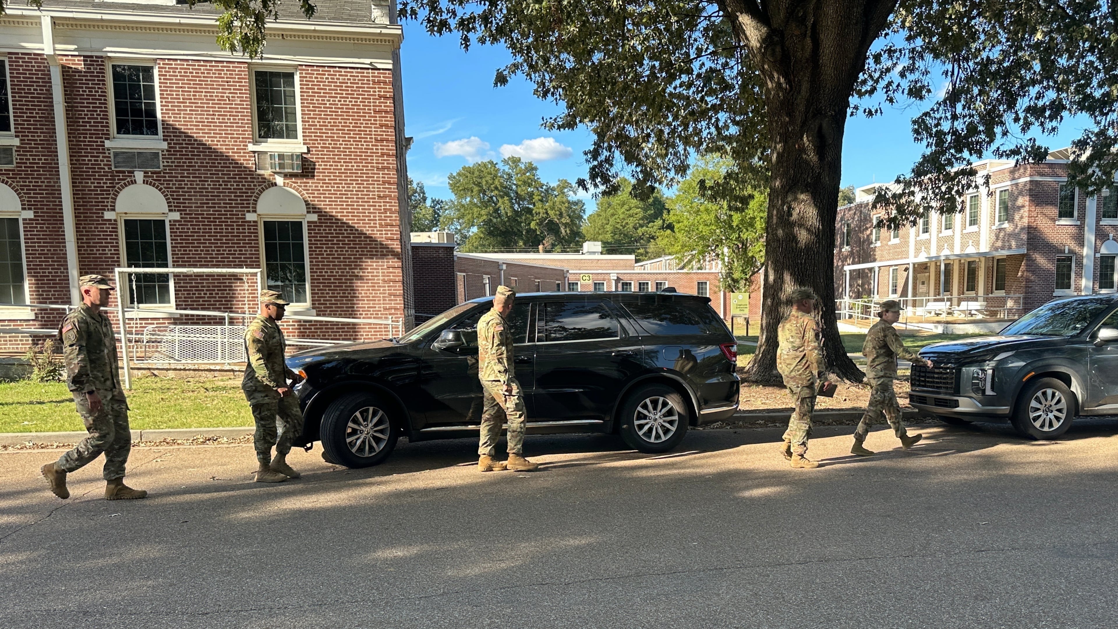 National Guard soldiers leave the Shelby County Office of Preparedness in Memphis, Tenn., Wednesday, Oct. 1, 2025. (AP Photo/Adrian Sainz)