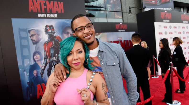 Rapper Clifford "T.I." Harris, a cast member of "Ant-Man," poses with his wife, Tameka “Tiny” Cottle-Harris, at the premiere of the film in 2015 in Los Angeles. (Photo by Chris Pizzello/Invision/AP)