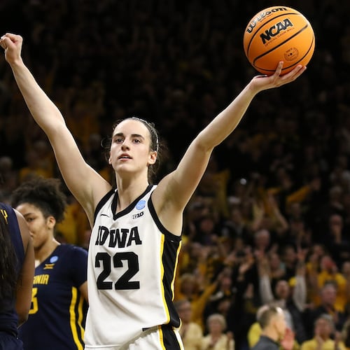 Guard Caitlin Clark of the Iowa Hawkeyes celebrates as time runs out in the second half against the West Virginia Mountaineers during their second round match-up in the 2024 NCAA Division 1 Women's Basketball Championship at Carver-Hawkeye Arena on March 25, 2024, in Iowa City, Iowa. (Matthew Holst/Getty Images/TNS)
