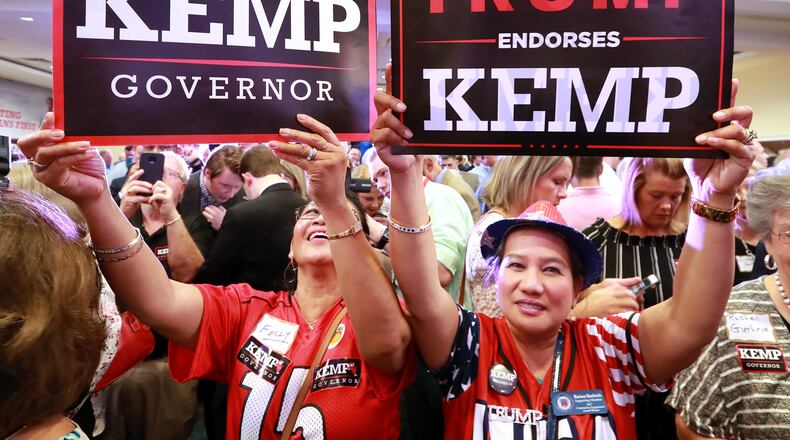 Felly Parker (left) and Marissa Hardwick at Brian Kemp’s victory party in Athens on Tuesday. Curtis Compton, ccompton@ajc.com
