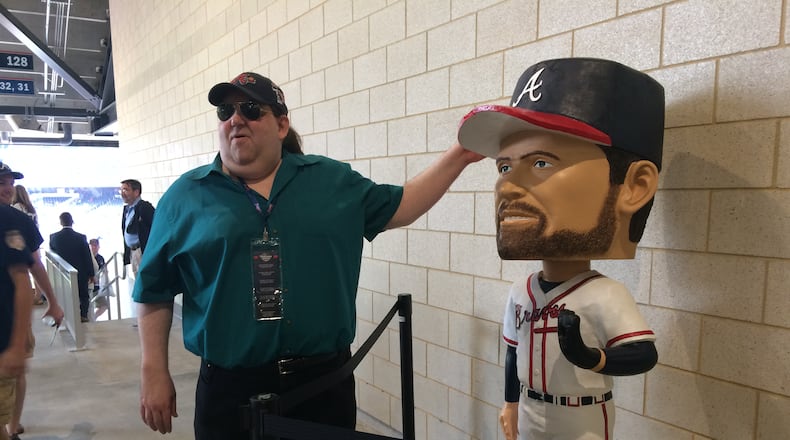 Joey Stuckey "meets" one of his favorite Braves players ever, Hall of Fame pitcher John Smoltz. The giant bobblehead is one of 10 found around SunTrust Park during the Braves inaugural season. Photo by Jill Vejnoska/jvejnoska@ajc.com