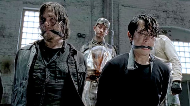 Daryl and Glenn are in a tight spot with a dude with a baseball bat, about to go all Robert DeNiro on their skulls. CREDIT: AMC