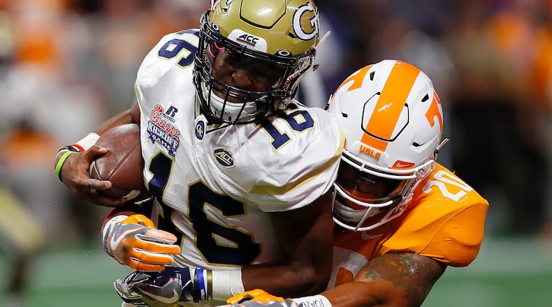 ATLANTA, GA - SEPTEMBER 04:  TaQuon Marshall #16 of the Georgia Tech Yellow Jackets is tackled by Cortez McDowell #20 of the Tennessee Volunteers at Mercedes-Benz Stadium on September 4, 2017 in Atlanta, Georgia.  (Photo by Kevin C. Cox/Getty Images)