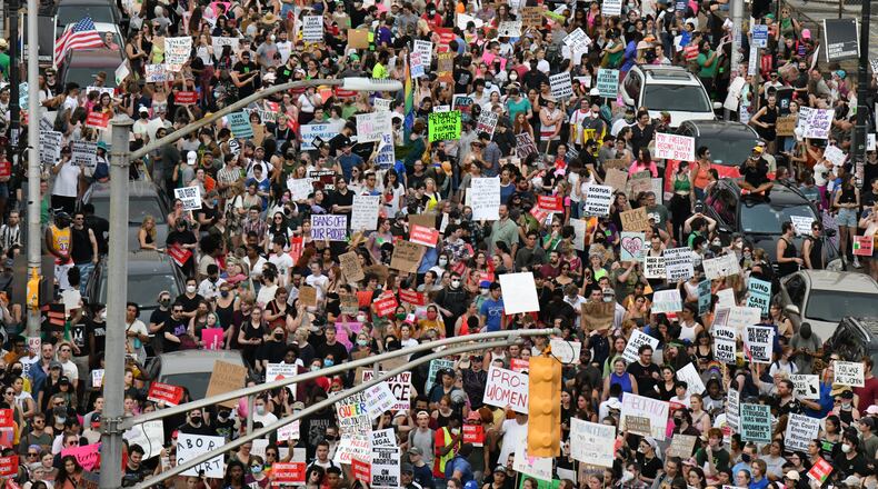 June 24, 2022 Atlanta - People march to protest the Supreme Court's decision to overturn Roe v. Wade in downtown Atlanta on Friday, June 24, 2022. (Hyosub Shin / Hyosub.Shin@ajc.com)