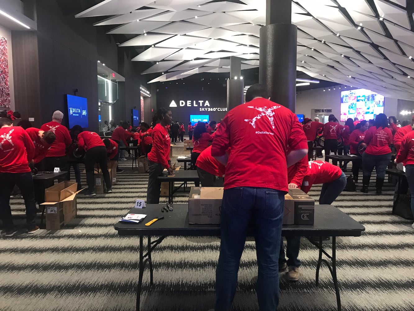 Delta volunteers assemble 100 bicycles to donate to kids