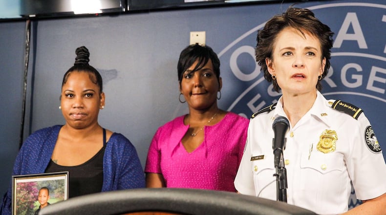 Allison Woods, left, whose son was shot after a football game, appeared with Atlanta Mayor Keisha Lance Bottoms and Atlanta Police Chief Erika Shields to urge the public's help in solving the crime. AJC photo: Alyssa Pointer