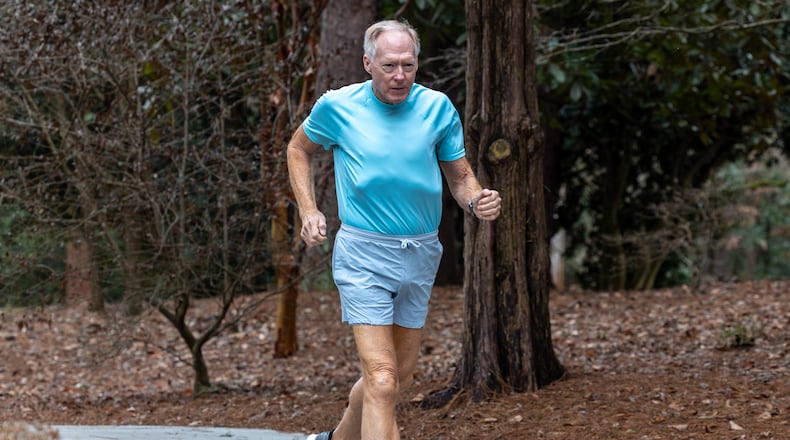 IN DECEMBER, LARRY GUZY REACHED A RECORD OF RUNNING A 10K A DAY OR THE EQUIVALENT FOR 1,000 DAYS. PHIL SKINNER FOR THE ATLANTA JOURNAL-CONSTITUTION