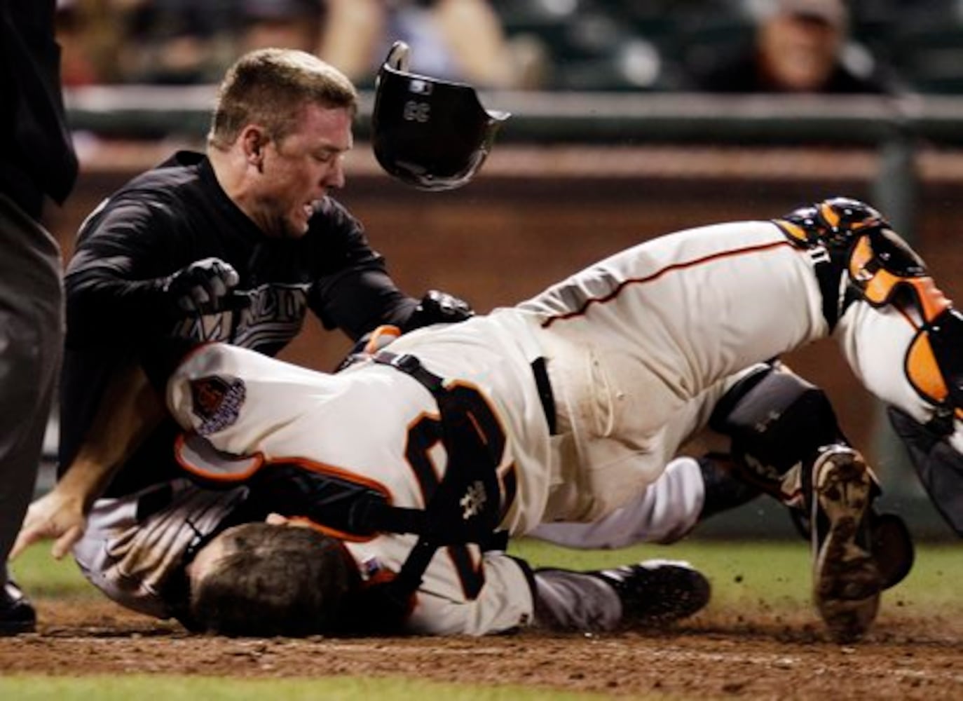 Catchers injured in home-plate collisions