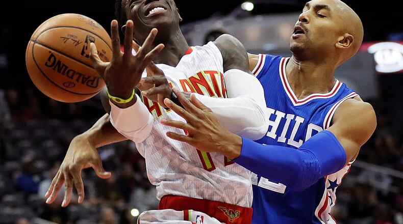 Philadelphia 76ers’ Gerald Henderson, right, fouls Atlanta Hawks’ Dennis Schroder in the first quarter of an NBA basketball game in Atlanta, Saturday, Nov. 12, 2016. (AP Photo/David Goldman)