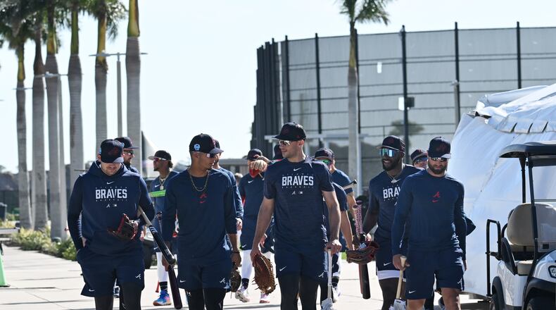 Atlanta Braves players walk to the stadium for their batting practice during Braves spring training at CoolToday Park, Thursday, Feb. 16, 2023, in North Port, Fla.. (Hyosub Shin / Hyosub.Shin@ajc.com)