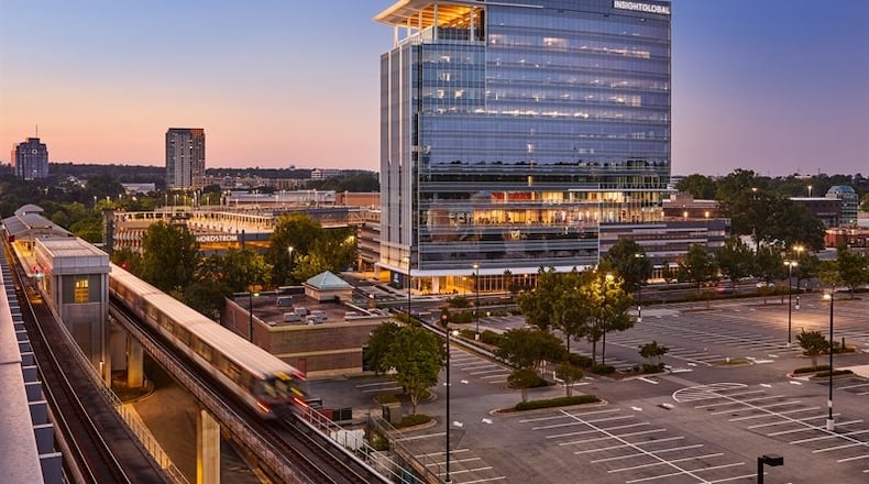 The new Twelve24 building towers over nearby Perimeter Mall.