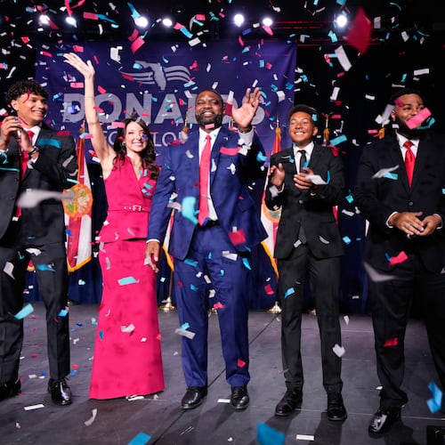 Florida Republican gubernatorial candidate Byron Donalds, center, waves next to his wife Erika, while standing on stage with their children Darin, left, Damon, second from left, and Mason during at a primary election party Tuesday, Aug. 18, 2026, in Orlando, Fla. (AP Photo/John Raoux)
