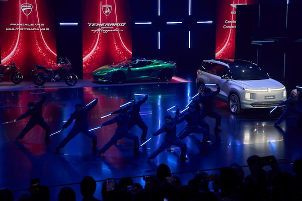 Performers take part in the Volkswagen Group media night ahead of the Auto Show in Shanghai, Tuesday, April 22, 2025. (AP Photo/Ng Han Guan)