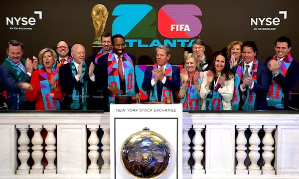 Lt. Gov. Burt Jones (far left), Atlanta Mayor Andre Dickens (at podium, red tie), Gov. Brian Kemp (center) and others rang the bell at the New York Stock Exchange on Monday. (Screenshot/NYSE)