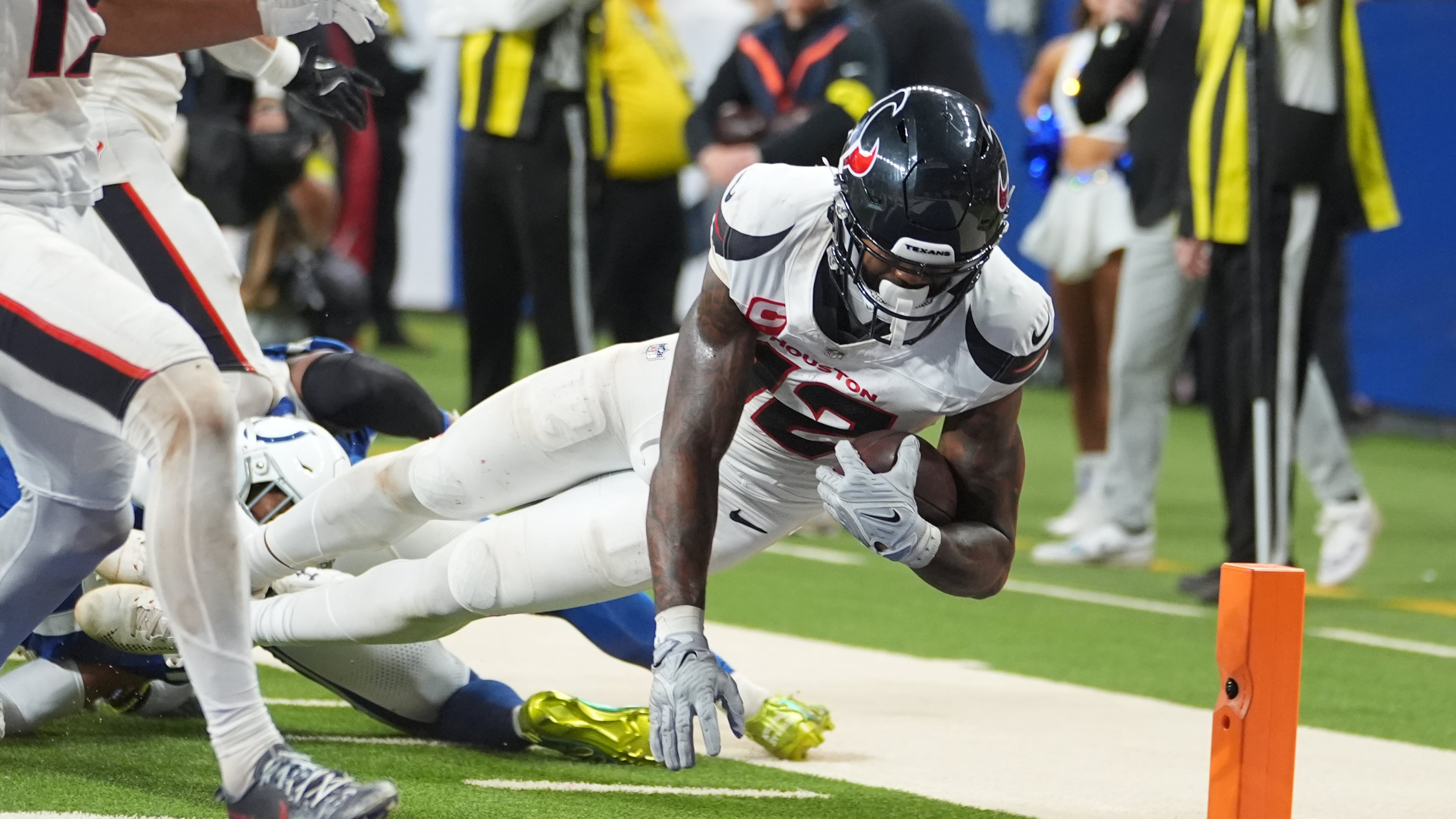 Houston Texans' Nico Collins (12) scores a touchdown against the Indianapolis Colts during the second half of an NFL football game Sunday, Nov. 30, 2025, in Indianapolis. (AP Photo/Michael Conroy)