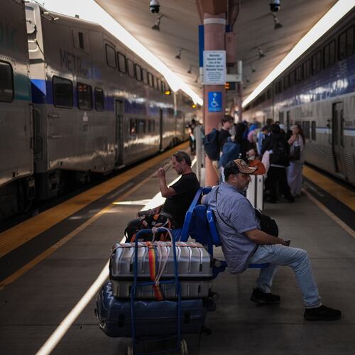 Travelers wait to board an Amtrak train at Union Station in Los Angeles, Wednesday, May 20, 2026. (AP Photo/Jae C. Hong)
