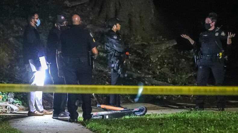 Atlanta police officers investigate the scene at the Pavilion Place Apartments on Cleveland Avenue.