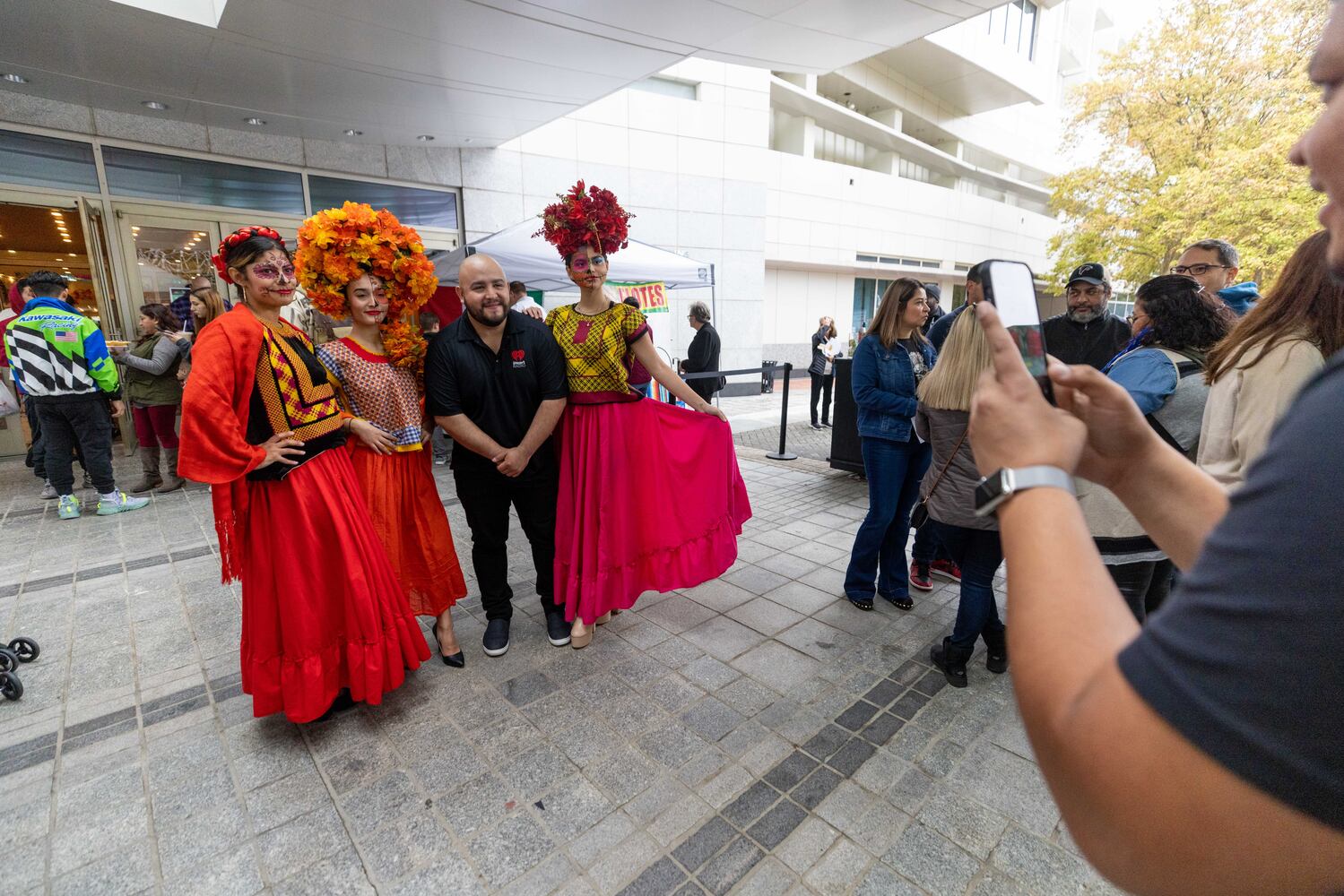 Dancers pose for a photo at the Dia de Los Muertos Festival hosted by the Atlanta Symphony Orchestra at the Woodruff Arts Center on Sunday, October 30, 2022. (Photo: Jenn Finch for The Atlanta Journal-Constitution)


