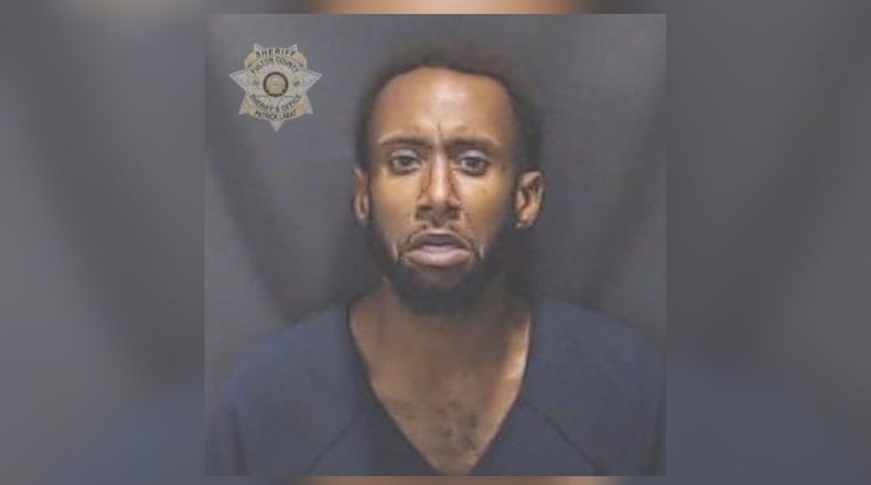 Shelton Cruz Handspike was arrested Thursday after a woman was shot dead Tuesday inside her East Point apartment.