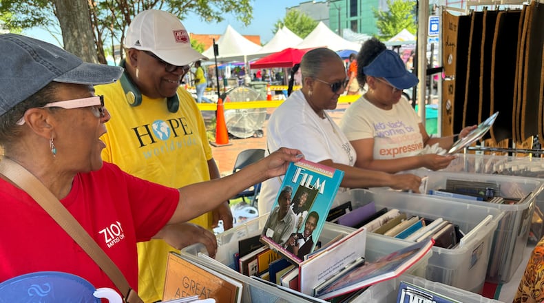 North River Church HOPE Worldwide gave away 2,000 Black History books last year during a Juneteenth celebration at the Marietta Square. The books were donated to HOPE by Books For Africa, also in Marietta. HOPE plans another Juneteenth books giveaway this year. Courtesy of North River HOPE Worldwide