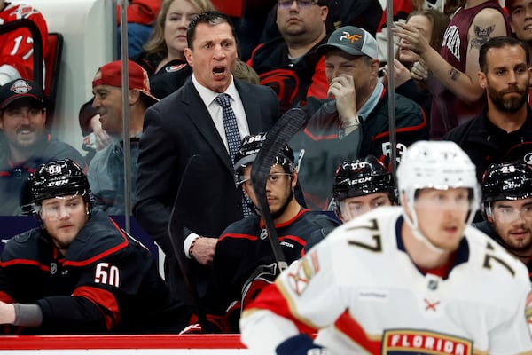 Carolina Hurricanes head coach Rod Brind'Amour watches from the bench during the first period of Game 1 of the NHL hockey Stanley Cup Eastern Conference finals against the Florida Panthers in Raleigh, N.C., Tuesday, May 20, 2025. (AP Photo/Karl DeBlaker)