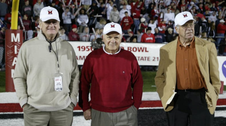 John Pont (center) with fellow members of the Cradle of Coaches Bo Schembechler (left) and Bill Mallory at a game at Yager Stadium in Oxford.