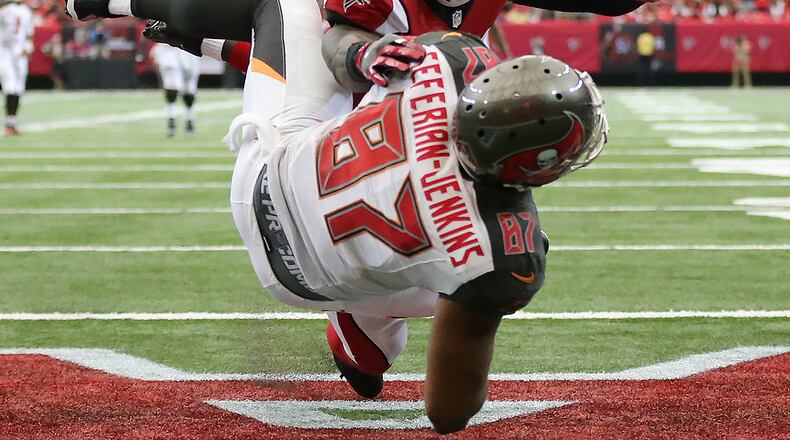 September 11, 2016 ATLANTA: Buccaneers tight end Austin Seferian-Jenkins catches a touchdown pass past Falcons linebacker Sean Weatherspoon for a 24-13 lead during the third quarter in an NFL football game on Sunday, Sept. 11, 2016, in Atlanta. Curtis Compton /ccompton@ajc.com