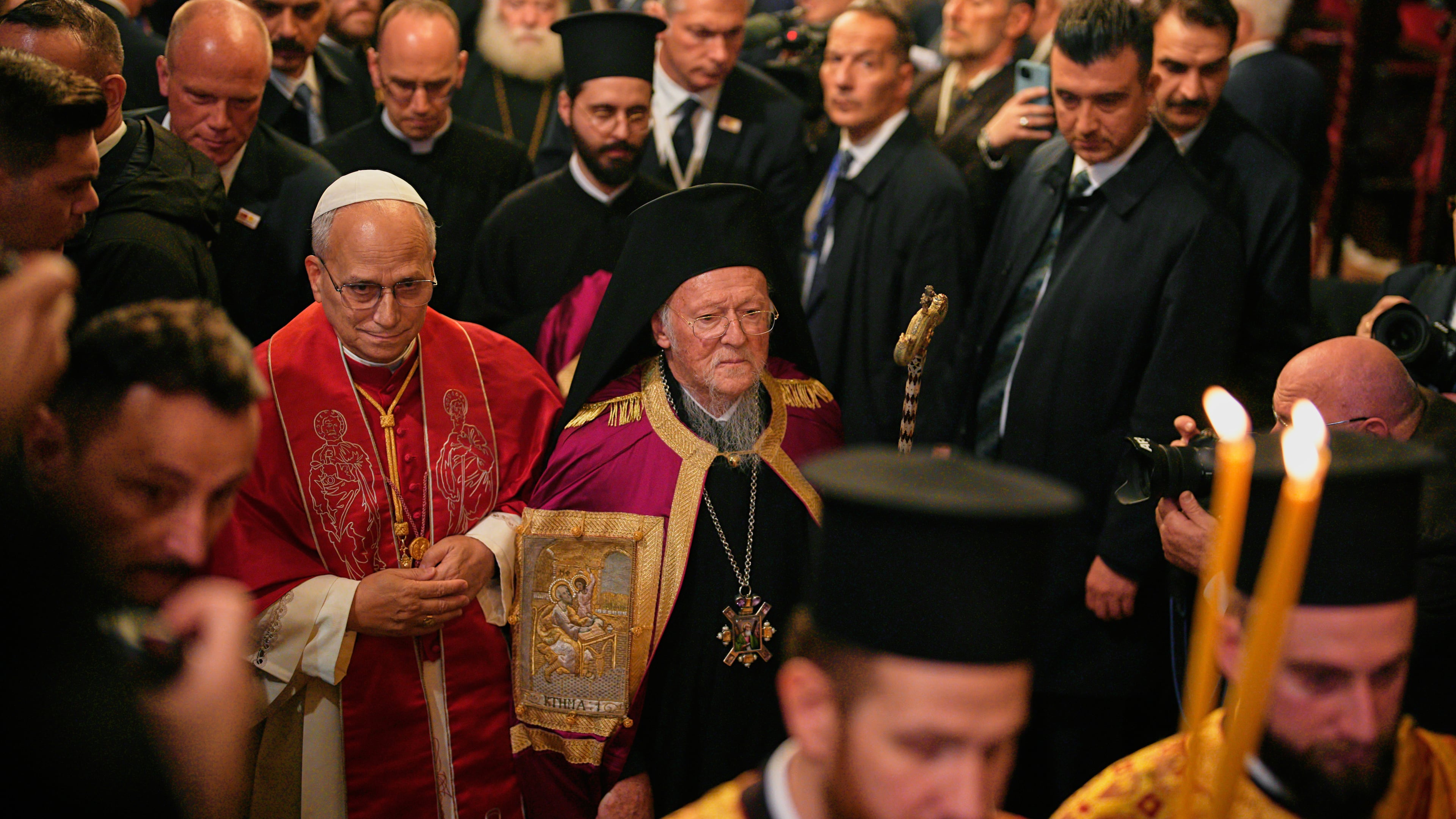 Pope Leo XIV and Ecumenical Patriarch Bartholomew I, the spiritual leader of the world's Eastern Orthodox Christians leave after attending the Doxology at the Patriarchal Church of Saint George, in Istanbul, Turkey, Saturday, Nov. 29, 2025. (AP Photo/Emrah Gurel)