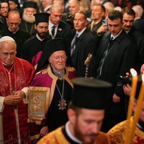 Pope Leo XIV and Ecumenical Patriarch Bartholomew I, the spiritual leader of the world's Eastern Orthodox Christians leave after attending the Doxology at the Patriarchal Church of Saint George, in Istanbul, Turkey, Saturday, Nov. 29, 2025. (AP Photo/Emrah Gurel)