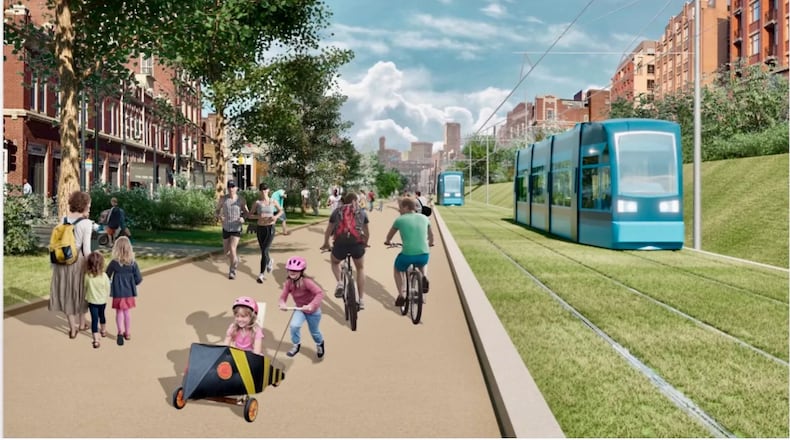 A happy rendition of what light rail might look like on the Beltline. Notice the trimmed, green, trash-free grass.