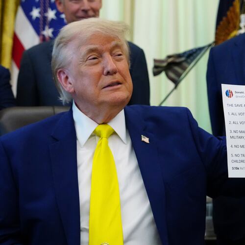 FILE - President Donald Trump holds up an image taken from his Truth Social account at an event about coal, Thursday, June 4, 2026, in the Oval Office of the White House in Washington. (AP Photo/Julia Demaree Nikhinson,File)