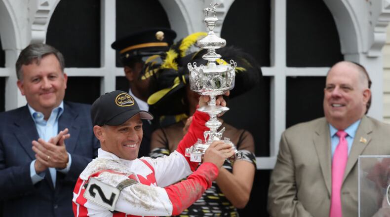 BALTIMORE, MD - MAY 20:  Javier Castellano #2 rider of Cloud Computing celebrates with the trophy alongside Baltimore City Stephanie Rawlings-Blake and Maryland Governor Larry Hogan after winning the 142nd running of the Preakness Stakes at Pimlico Race Course on May 20, 2017 in Baltimore, Maryland.  (Photo by Rob Carr/Getty Images)