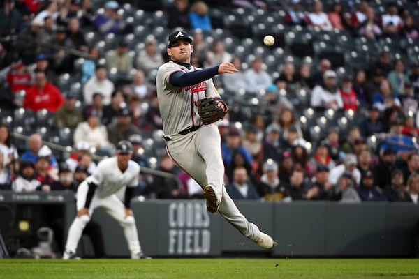 Braves third baseman Austin Riley makes a throw during Tuesday's game against the Rockies.