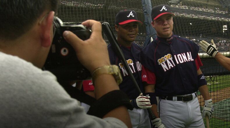 Braves All-Stars Andruw Jones (left) and Chipper Jones pose for photographs during NL practice before the 2000 All-Star Game at Turner Field in Atlanta.