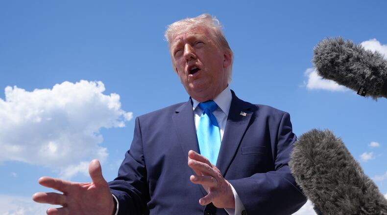 President Donald Trump speaks to the press after returning and stepping off Air Force One, Wednesday, May 20, 2026, at Joint Base Andrews, Md., after speaking at the U.S. Coast Guard Academy commencement. (AP Photo/Jacquelyn Martin)