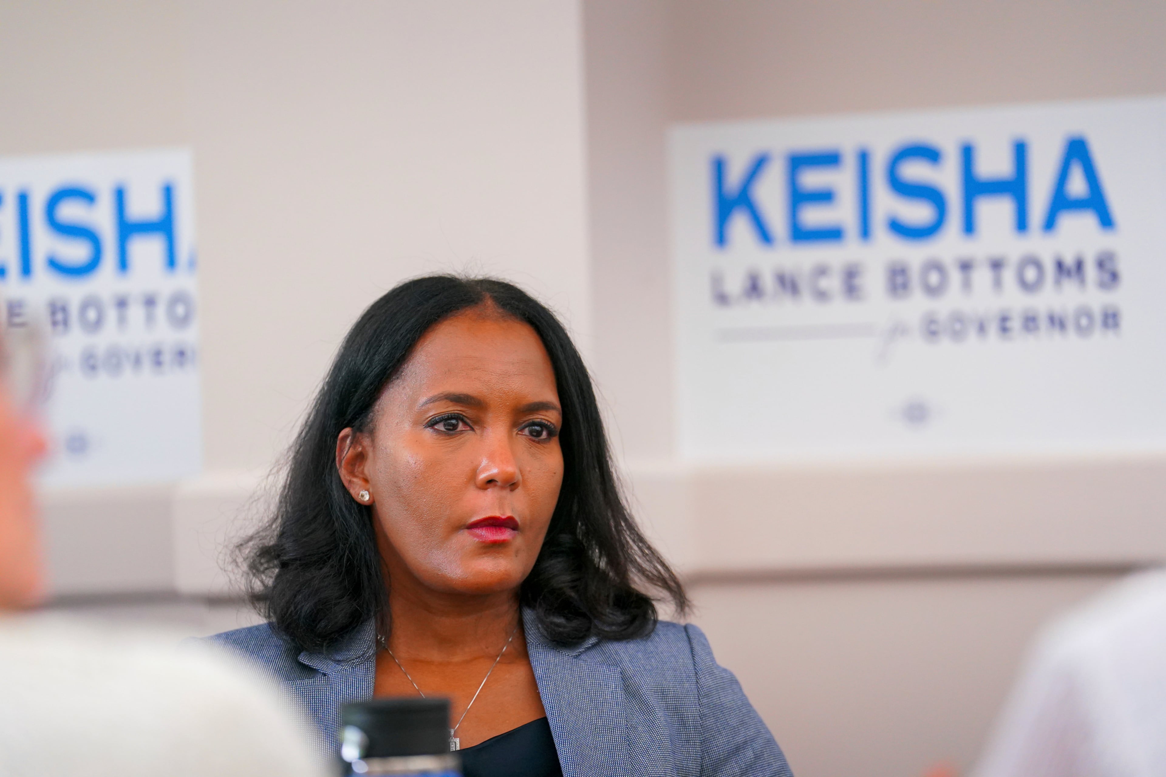 Georgia Democratic gubernatorial candidate and former Atlanta Mayor Keisha Lance Bottoms listens to laid off Centers for Disease Control and Prevention (CDC) workers during a roundtable in Clarkston, Ga., at the the start of her campaign tour, Thursday, July 24, 2025. (Matthew Pearson/WABE via AP)