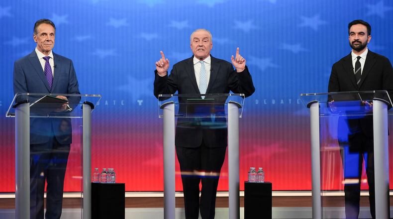 Republican candidate Curtis Sliwa, center, speaks during a mayoral debate with independent candidate former New York Gov. Andrew Cuomo, left, and Democratic candidate Zohran Mamdani, Thursday, Oct. 16, 2025, in New York. (AP Photo/Angelina Katsanis, Pool)