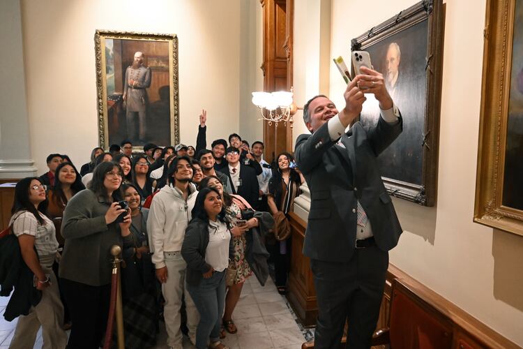 State Sen. Drew Echols (right) takes a selfie with Latino students and children as they visit the Georgia state Capitol in 2025. Latinos are 16% of Georgia’s K-12 students. (Hyosub Shin/AJC)