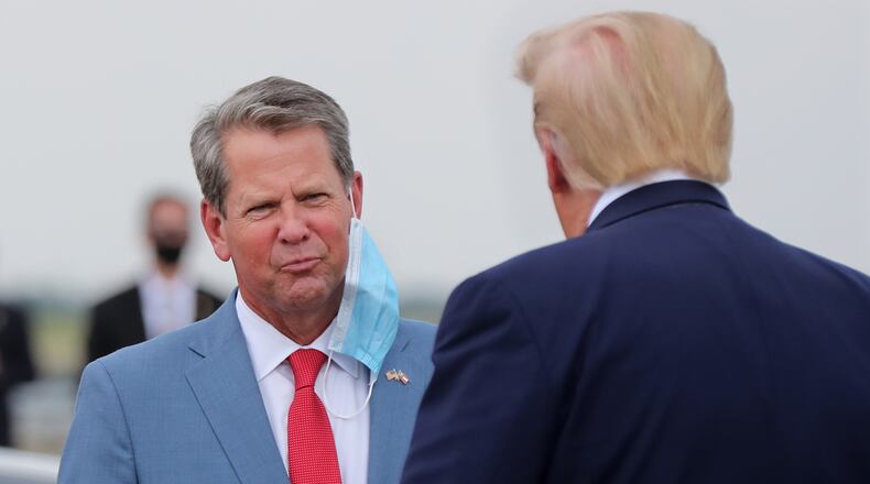 071520 Atlanta: Georgia Governor Brian Kemp greets President Donald Trump as he visits Georgia to talk about an infrastructure overhaul at the UPS Hapeville hub at Hartsfield-Jackson International Airport on Wednesday July 15, 2020 in Atlanta. The visit focuses on a rule change designed to make it easier to process environmental reviews.  Curtis Compton ccompton@ajc.com