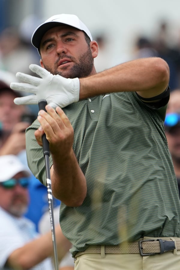 Scottie Scheffler reacts to his tee shot on the 15th hole during the second round of the U.S. Open golf tournament at Oakmont Country Club Friday, June 13, 2025, in Oakmont, Pa. (AP Photo/Gene J. Puskar)