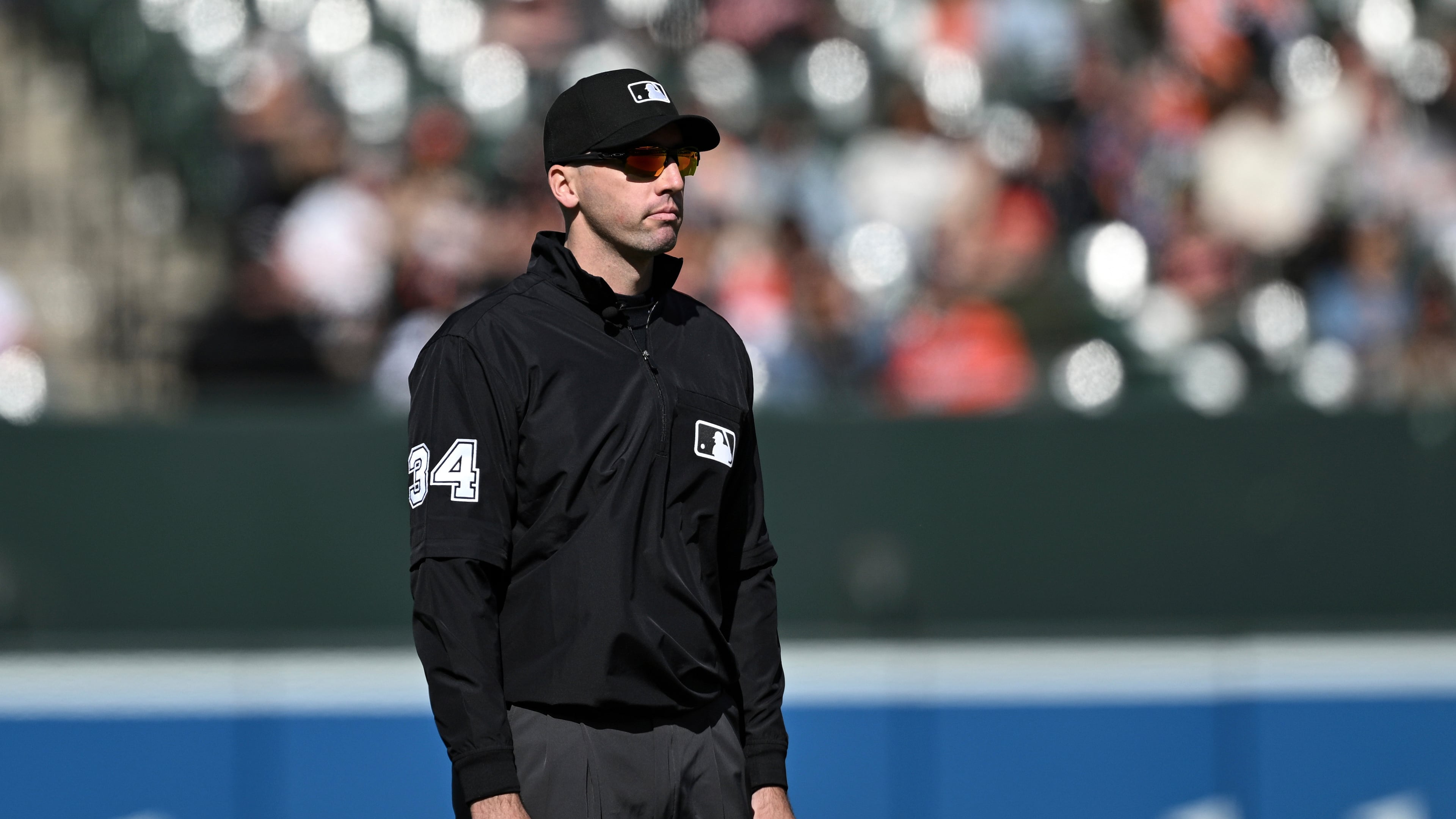 FILE - Umpire Nate Tomlinson looks on during a baseball game between the Baltimore Orioles and the Toronto Blue Jays in Baltimore, April 13, 2025. (AP Photo/Terrance Williams, File)