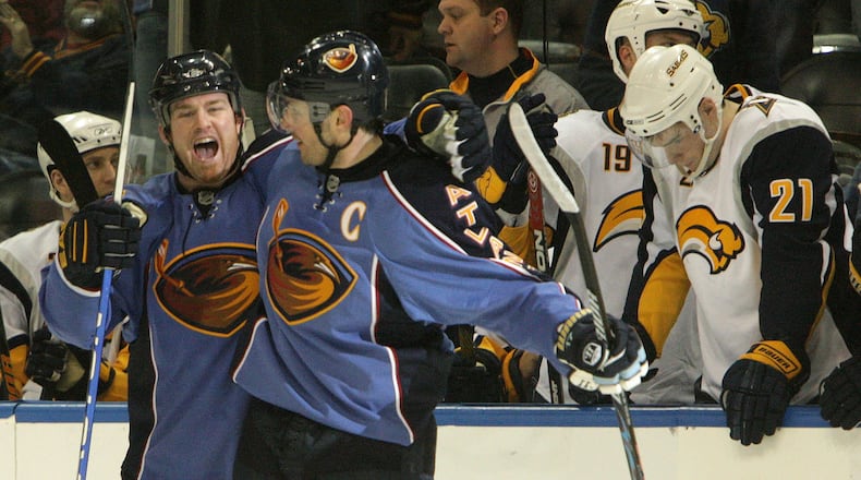 Eric Boulton #36 celebrates with Ilya Kovalchuk (17) after he made the game winning goal in overtime during the Atlanta Thrashers game against the Buffalo Sabres on Wednesday, April 1, 2009 as Sabres Drew Stafford (21) holds his head down in the background. JOHNNY CRAWFORD/ jcrawford@ajc.com