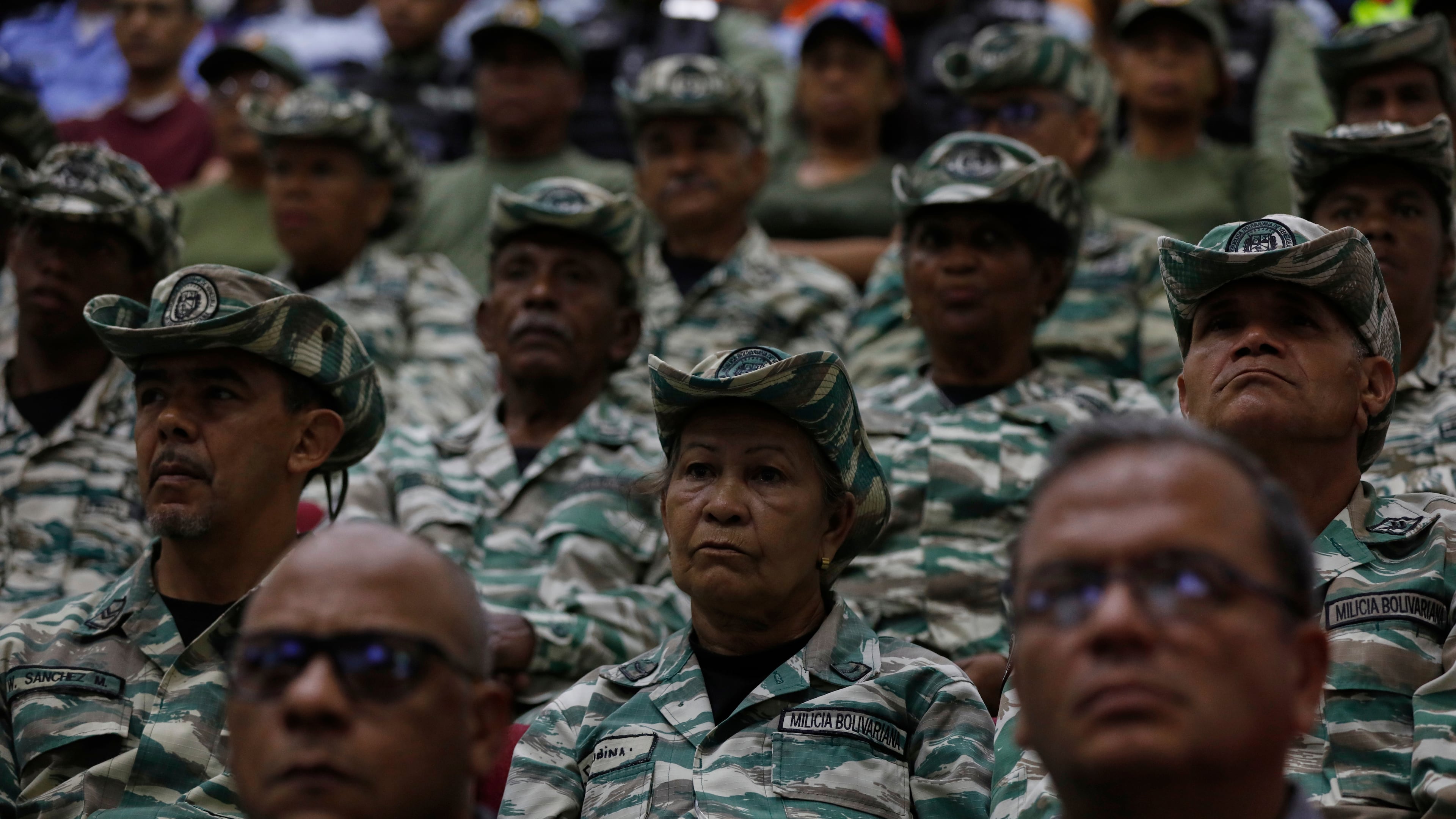 Members of the Bolivarian Militia listen to a recorded speech by President Nicolás Maduro at a military garrison in Caracas, Venezuela, Friday, Sept. 5, 2025. (AP Photo/Cristrian Hernandez)